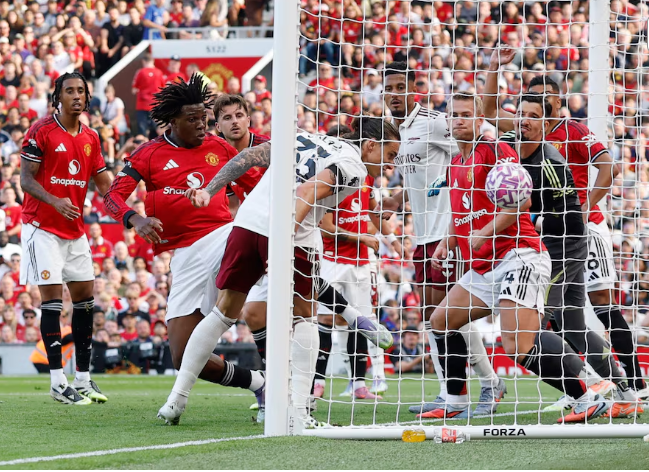 Riccardo Calafiori heads Arsenal’s winner against Manchester United at Old Trafford.