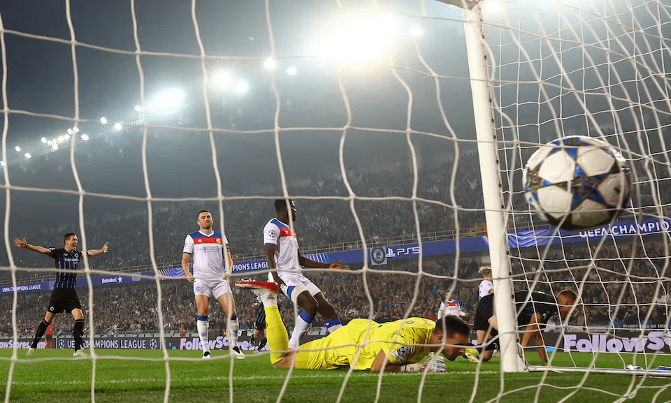 Club Brugge’s Nicolo Tresoldi celebrates scoring the opener as Rangers goalkeeper Jack Butland looks dejected in Champions League playoff.