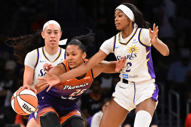 Alyssa Thomas battles for a loose ball during Phoenix Mercury vs Los Angeles Sparks game, August 26, 2025