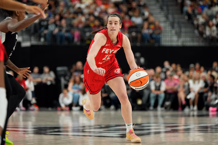 Caitlin Clark of Indiana Fever dribbling the ball during WNBA game against Las Vegas Aces