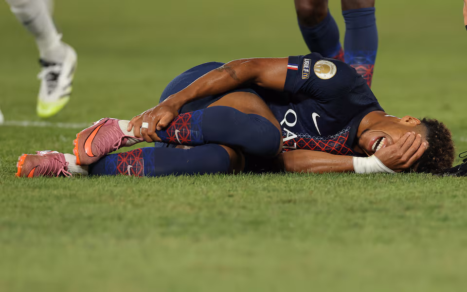 Paris Saint-Germain winger Desire Doue in action before suffering a calf injury