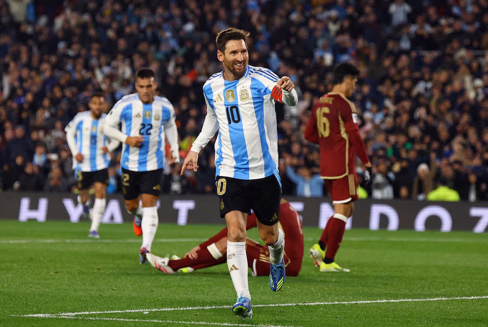 Lionel Messi celebrates scoring against Venezuela in World Cup qualifier