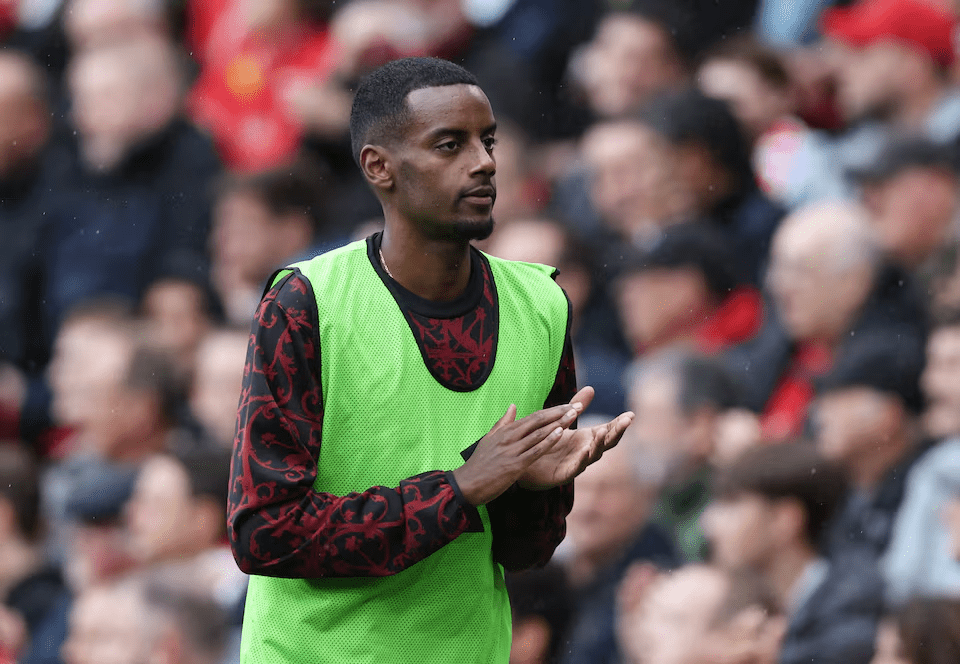 Alexander Isak warms up as a substitute during a Premier League match between Liverpool and Everton, September 20, 2025
